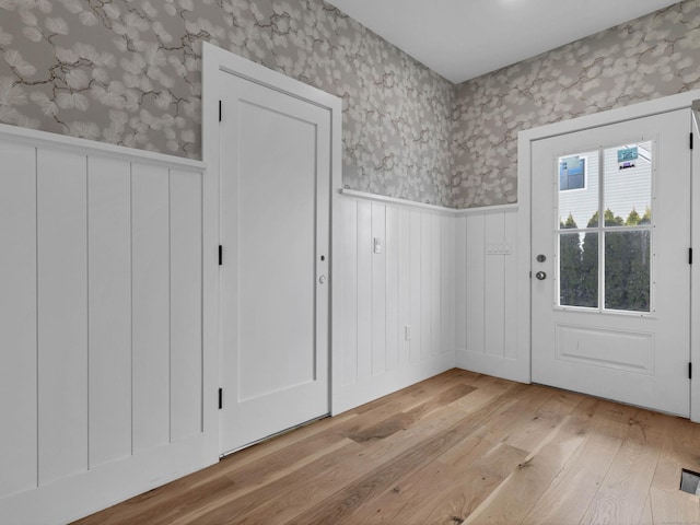 entryway with light hardwood / wood-style flooring