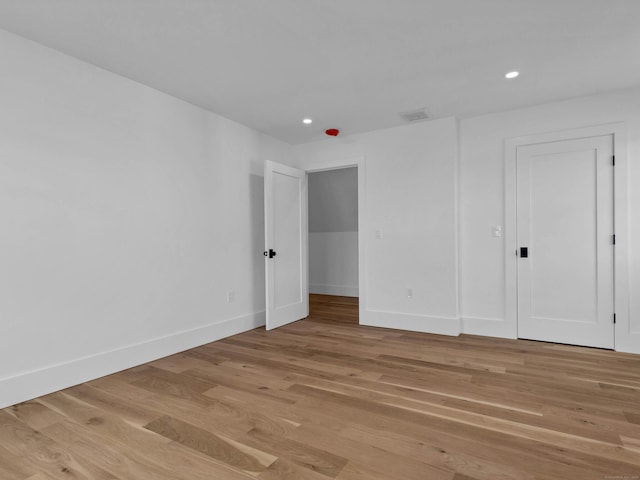 unfurnished bedroom with light wood-type flooring