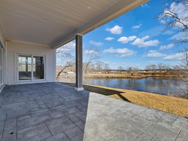 view of patio featuring a water view