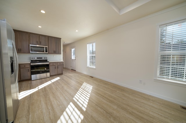 kitchen featuring light wood-type flooring and stainless steel appliances