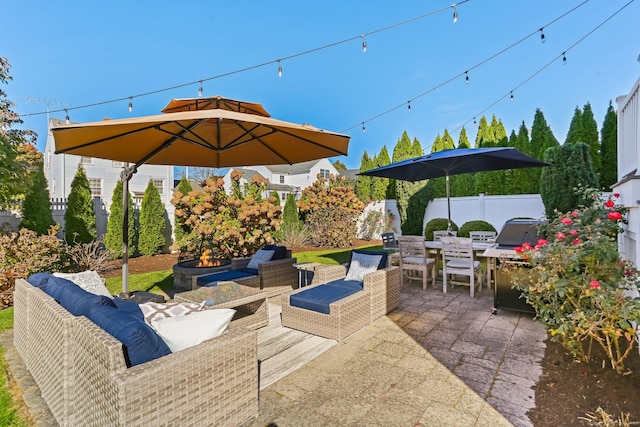 view of patio / terrace featuring an outdoor living space with a fire pit