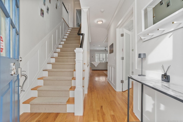 entryway with light wood-type flooring and ceiling fan