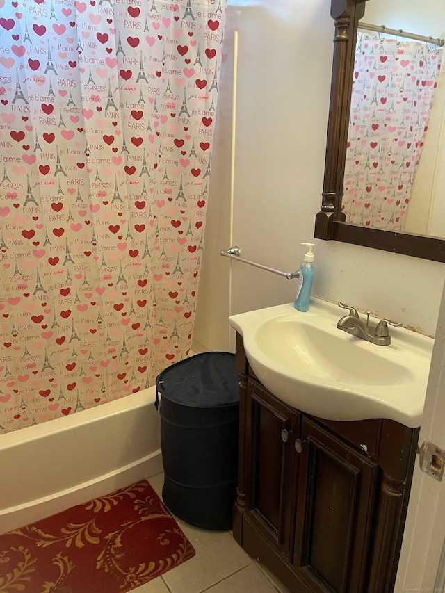 bathroom featuring vanity, tile patterned flooring, and shower / tub combo with curtain