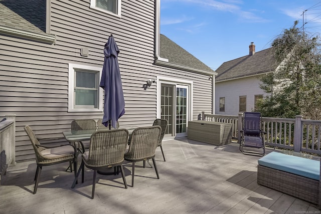 wooden terrace with outdoor dining area