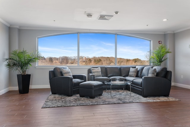 living room with wood-type flooring and crown molding