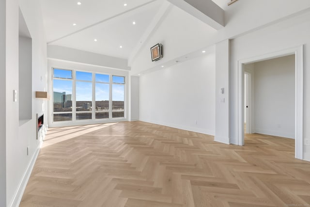 unfurnished living room featuring a high ceiling and light parquet floors