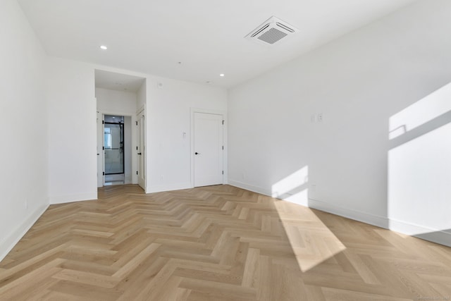 unfurnished room featuring light parquet floors