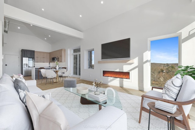 living room with a wealth of natural light, beam ceiling, high vaulted ceiling, and light parquet flooring