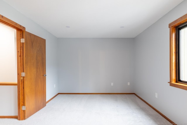 empty room featuring light colored carpet