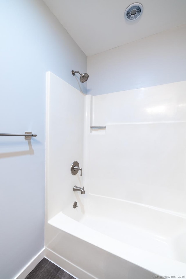 bathroom with shower / tub combination