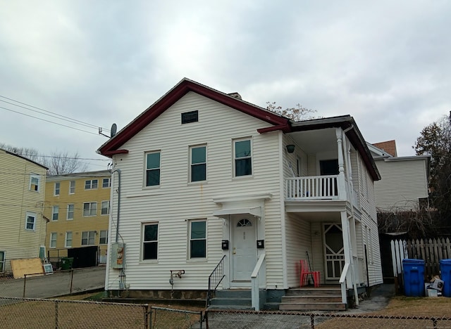 view of front of property with a balcony