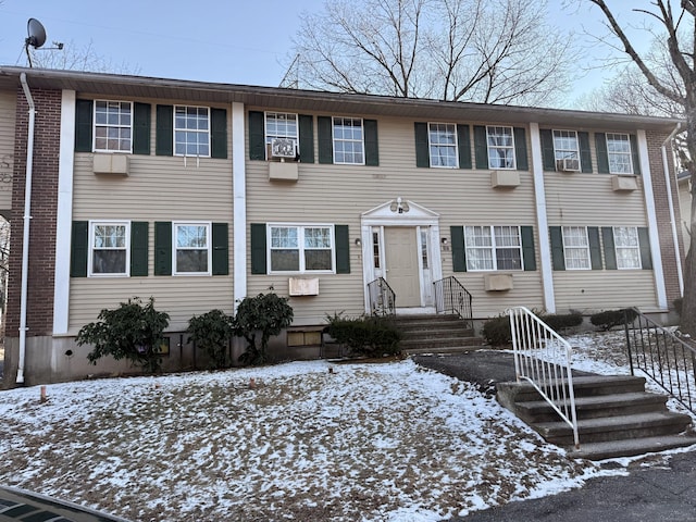 colonial home featuring cooling unit