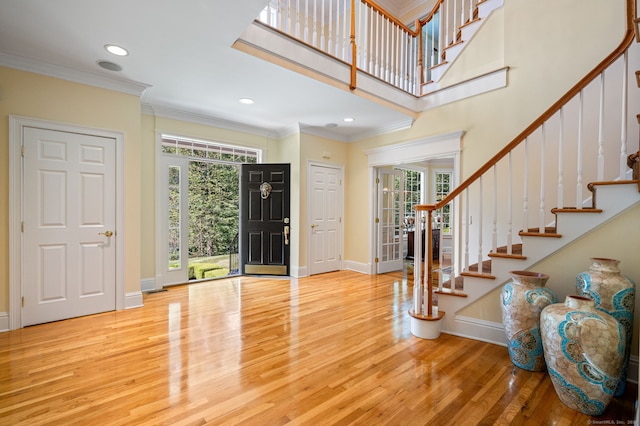 entryway featuring crown molding and wood-type flooring