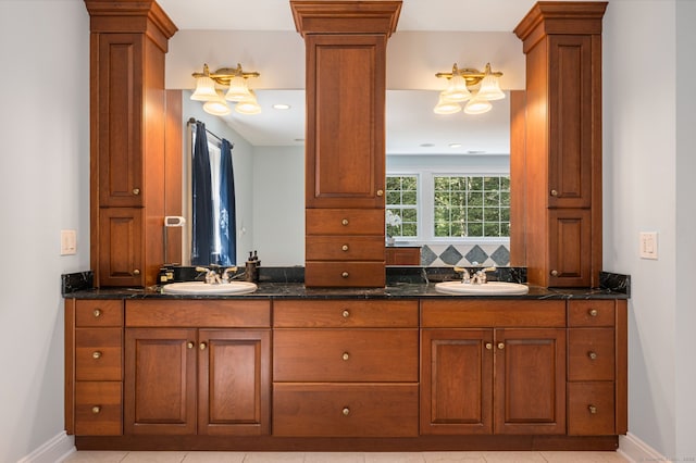 bathroom featuring tile patterned flooring, vanity, and backsplash