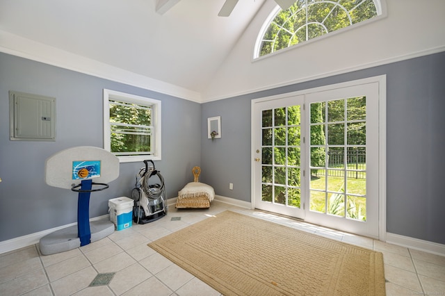 living area with electric panel, ceiling fan, light tile patterned flooring, and high vaulted ceiling