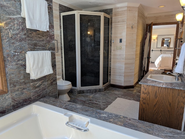 bathroom with vanity, crown molding, toilet, and a stall shower