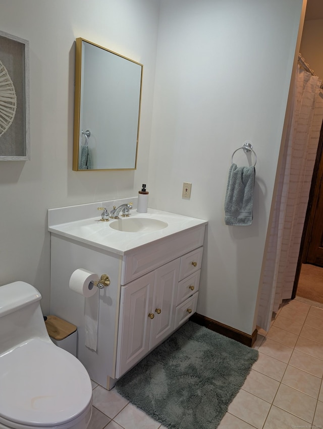 full bathroom featuring vanity, tile patterned floors, toilet, and baseboards