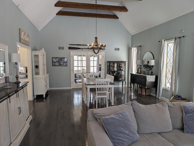 dining space with dark wood-style floors, visible vents, beamed ceiling, and plenty of natural light