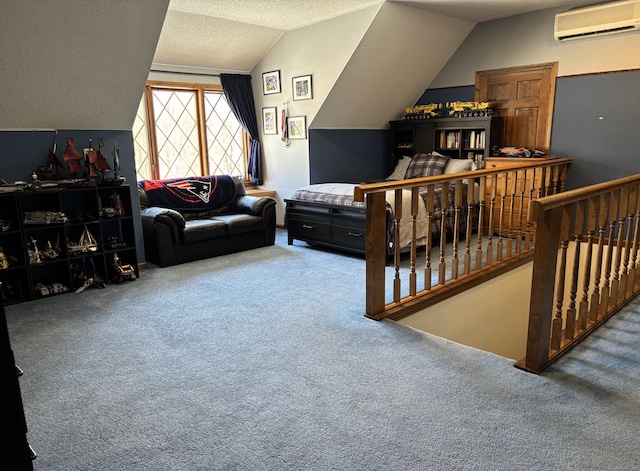 carpeted bedroom with a textured ceiling, a wall mounted air conditioner, and vaulted ceiling