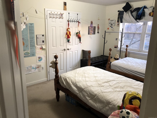 bedroom featuring a closet and carpet floors