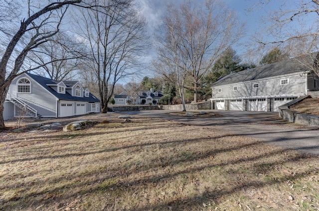 view of yard featuring a garage