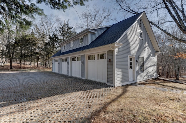 view of side of property featuring a garage