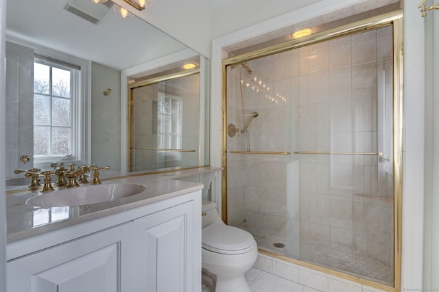 full bath with marble finish floor, toilet, vanity, and a stall shower