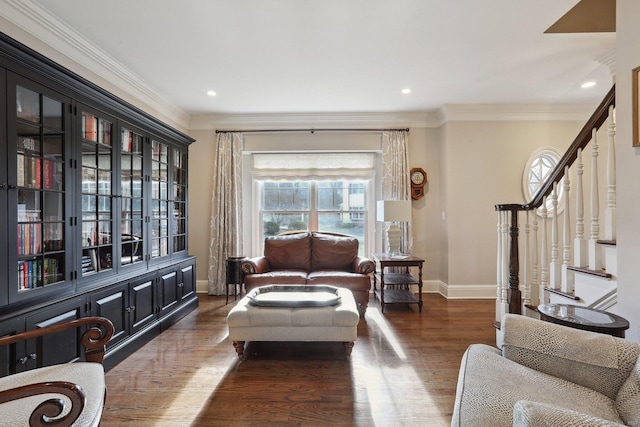 living area with crown molding and dark wood-type flooring