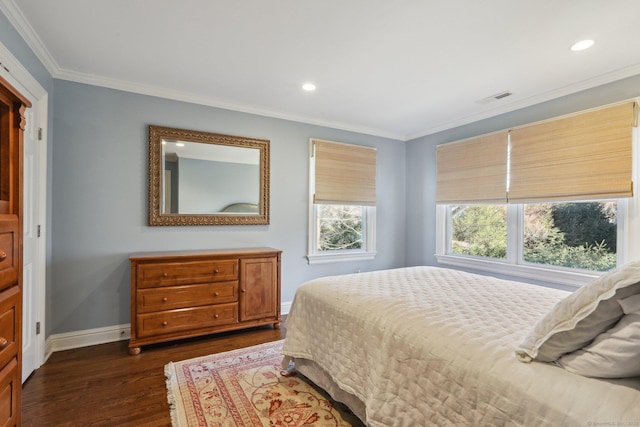 bedroom featuring ornamental molding and dark hardwood / wood-style floors