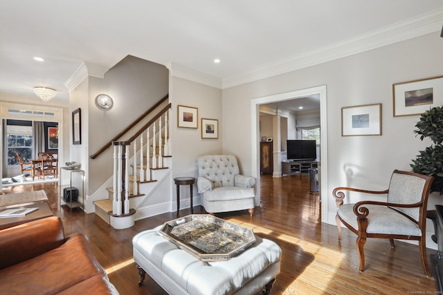 living room with ornamental molding and dark hardwood / wood-style floors