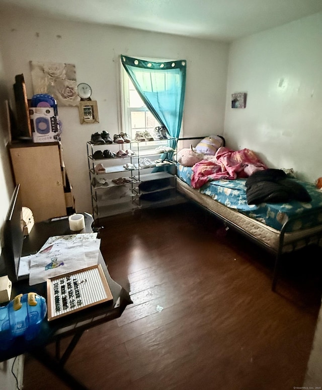 bedroom featuring dark hardwood / wood-style flooring