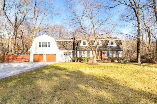 new england style home featuring a front lawn