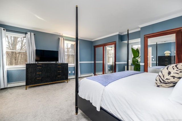 bedroom with a baseboard heating unit, carpet floors, and crown molding