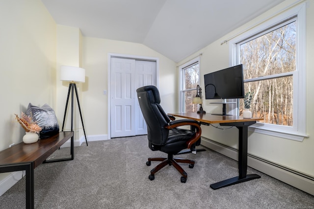 carpeted office featuring lofted ceiling