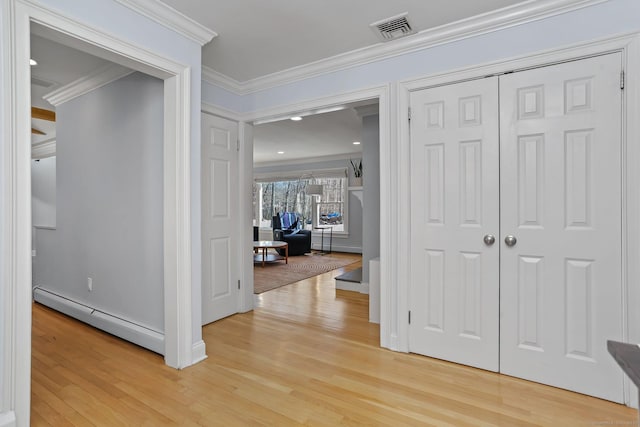 hall with baseboard heating, ornamental molding, and light hardwood / wood-style floors