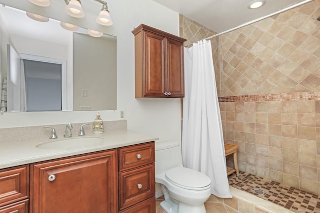 bathroom with vanity, toilet, and walk in shower