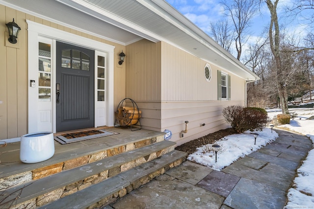 view of snow covered property entrance