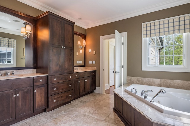 bathroom featuring ornamental molding, a bathtub, and vanity