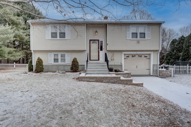 split foyer home featuring a garage