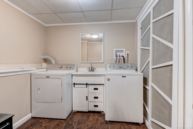 laundry room featuring sink, washer and clothes dryer, crown molding, and dark hardwood / wood-style floors