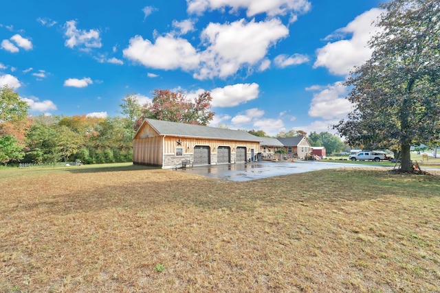 exterior space with a yard and an outbuilding