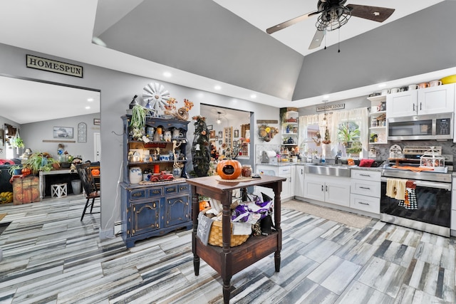 kitchen with ceiling fan, white cabinetry, sink, and appliances with stainless steel finishes