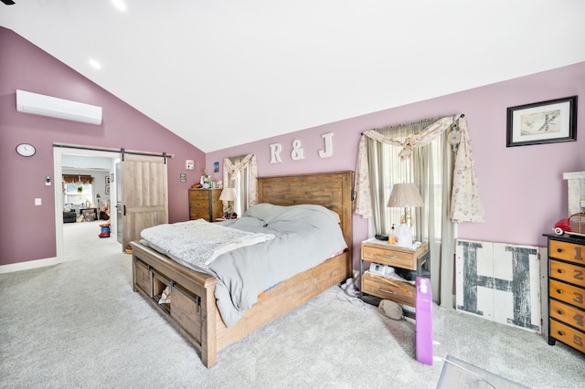 carpeted bedroom featuring a wall mounted air conditioner, a barn door, and lofted ceiling