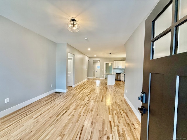 unfurnished living room featuring light hardwood / wood-style floors