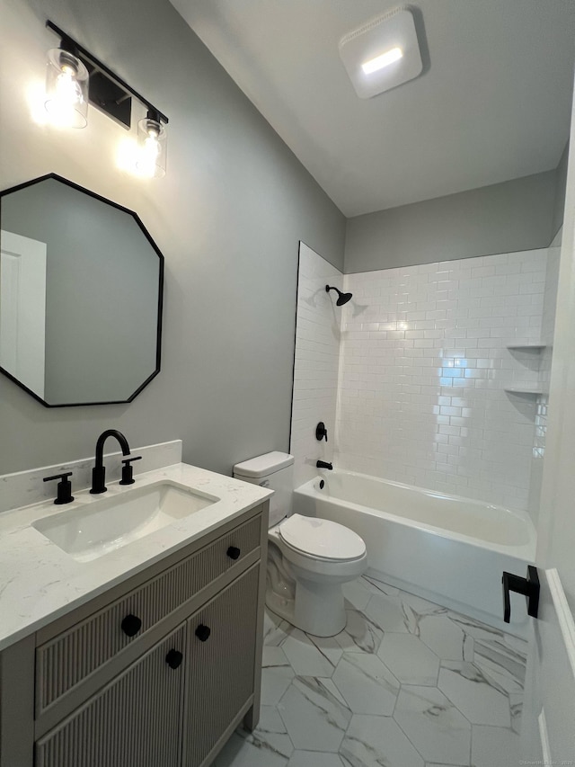 full bathroom featuring vanity, toilet, and tiled shower / bath