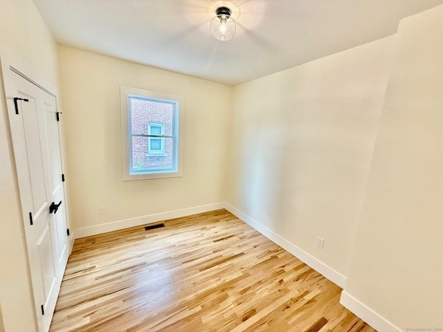 unfurnished room featuring light hardwood / wood-style floors