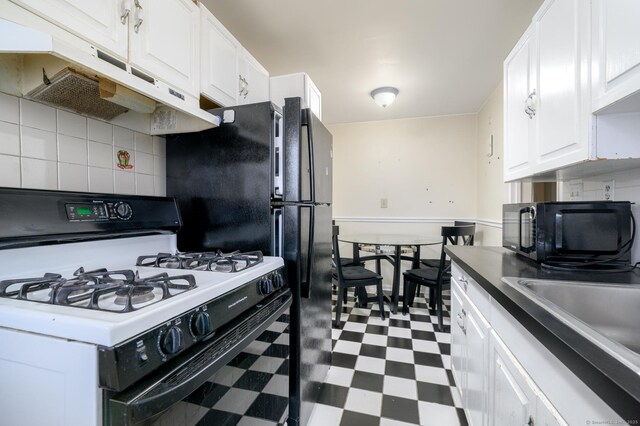 kitchen with sink, gas range gas stove, backsplash, and white cabinetry