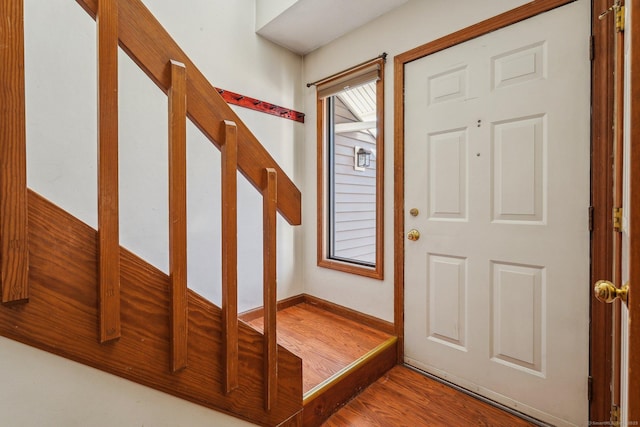 foyer entrance with hardwood / wood-style flooring