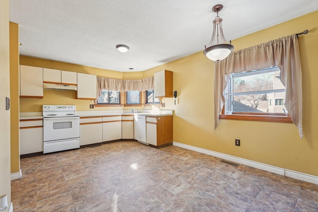 kitchen featuring decorative light fixtures, white appliances, a textured ceiling, and white cabinets