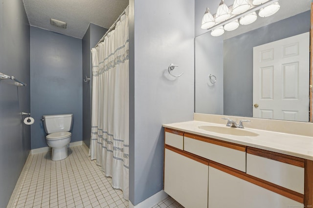 bathroom featuring toilet, a textured ceiling, tile patterned floors, and vanity